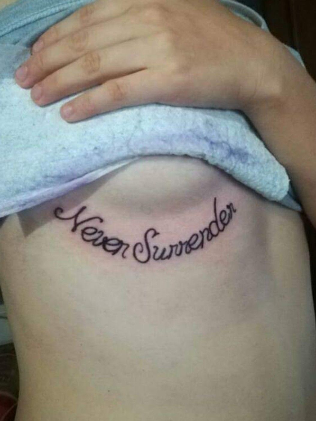 We Shall Never Surrender tattoo