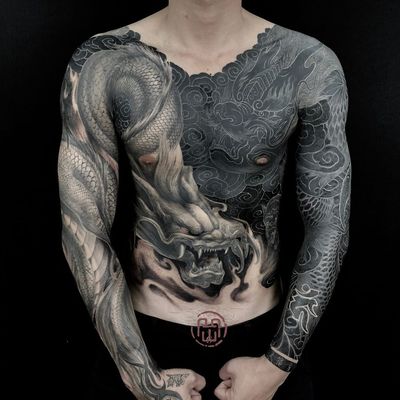 Tattoo by Heng Yue #HengYue #YinYangtattoos #YinYang #Chinese #symbol #blackandgrey #bodysuit #dragons #clouds #blackfill #chestpiece #sleeves #bodysuit #mythicalcreature #whiteink