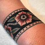Tattoo by Steve Zimovan #flower #flowers #dots #wristtattoo #wristcuff #brightandbold #traditional #traditionaltattoo #ashevillenc #ashevilletattoos 