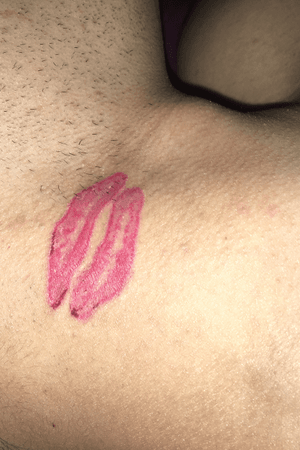 Lips neck tattoo