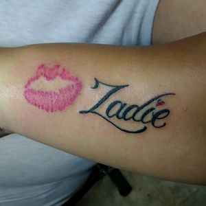 Lips and script tattoo