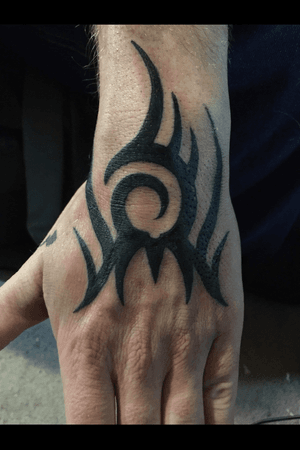 simple tribal hand tattoo