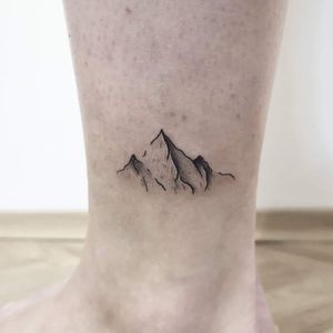 Minimalistic mountain piece ❤️More works on my instagram: @nikita.tattoo#tattooartist #tattooart #linework #lineworker #lineworktattoo #thinlinetattoo #fineline #dotwork #mountaintattoo #mountains #minimalism #minimalistic #minimalistictattoo #tattooideas 