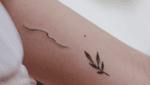 Handpoked wave tattoo