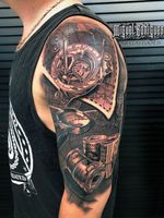 Tattoo arm, compass, map, money