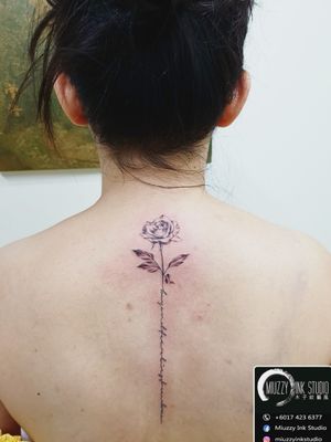 Rose back tattoo