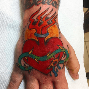 Sacred heart on the hand! #philadelphia #heart #handtattoo #color #traditional #americana #boldwillhold 