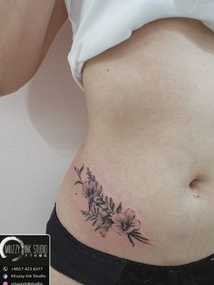 Floral waist tattoo