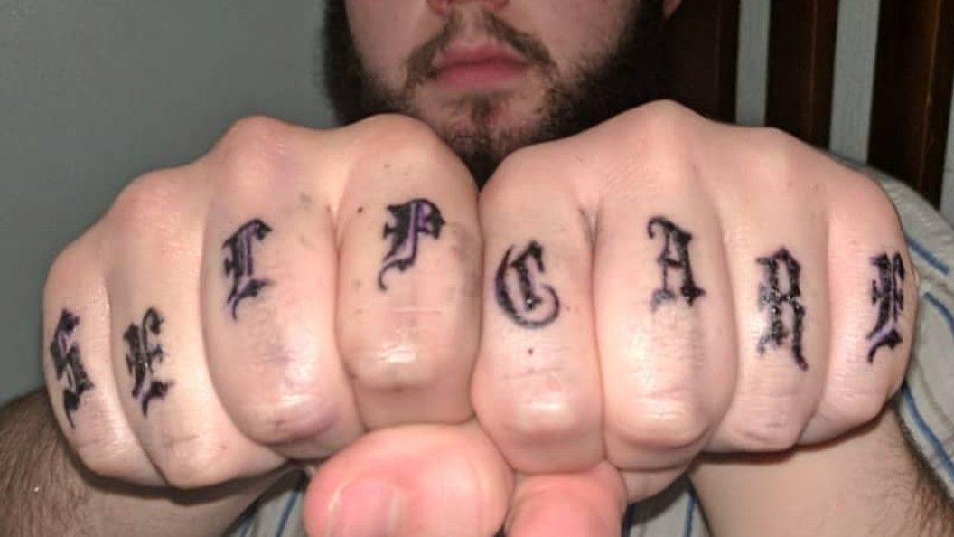 thug life tattoo on knuckles
