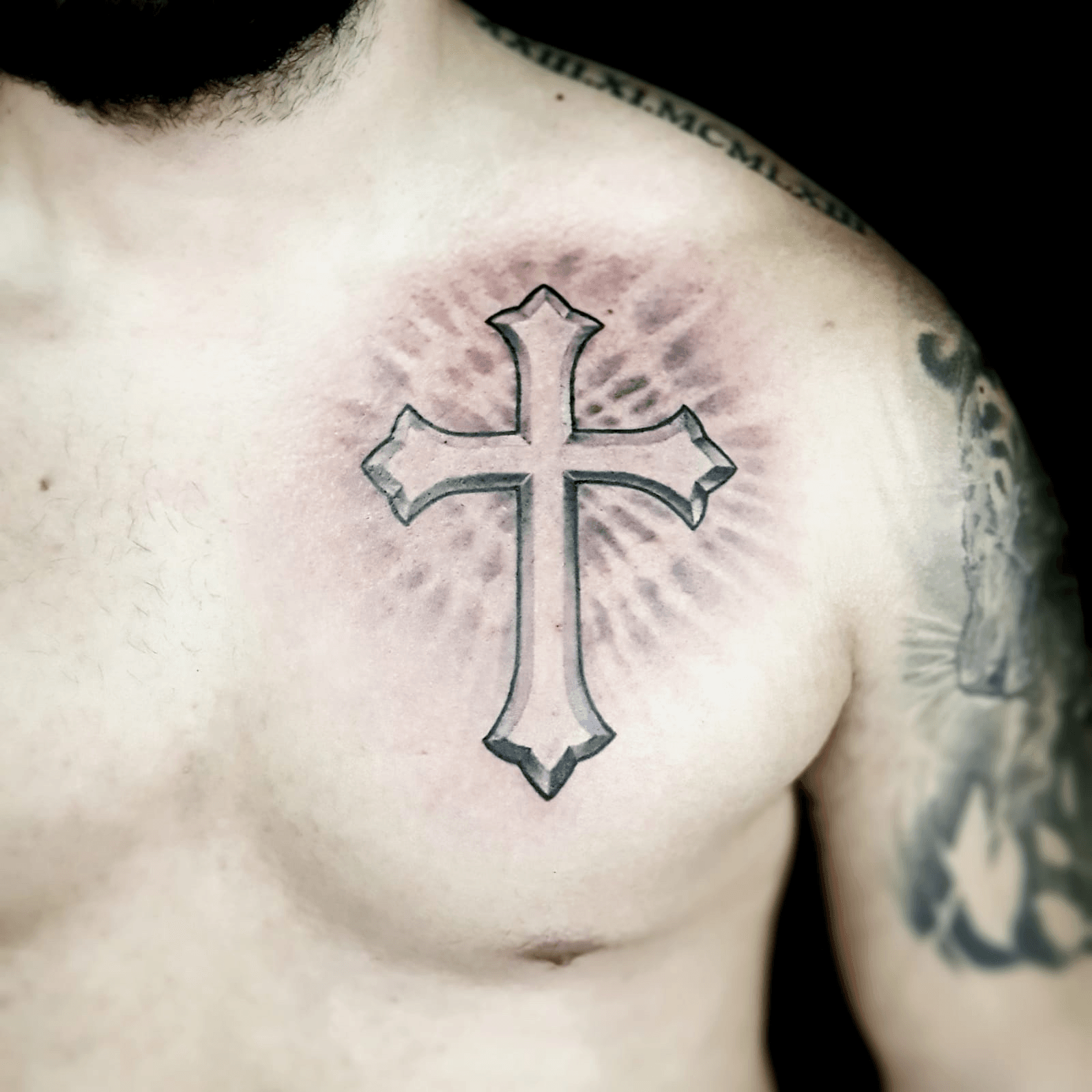 A Shirtless Man with Cross Tattoo on His Chest  Free Stock Photo