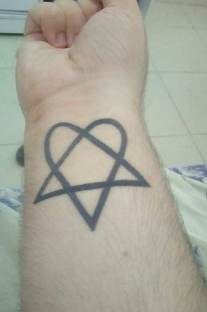 My first tattoo, a heartagram in my right wrist. I'm just a big fan of HIM and I want to do a lot more tattoos about the band.