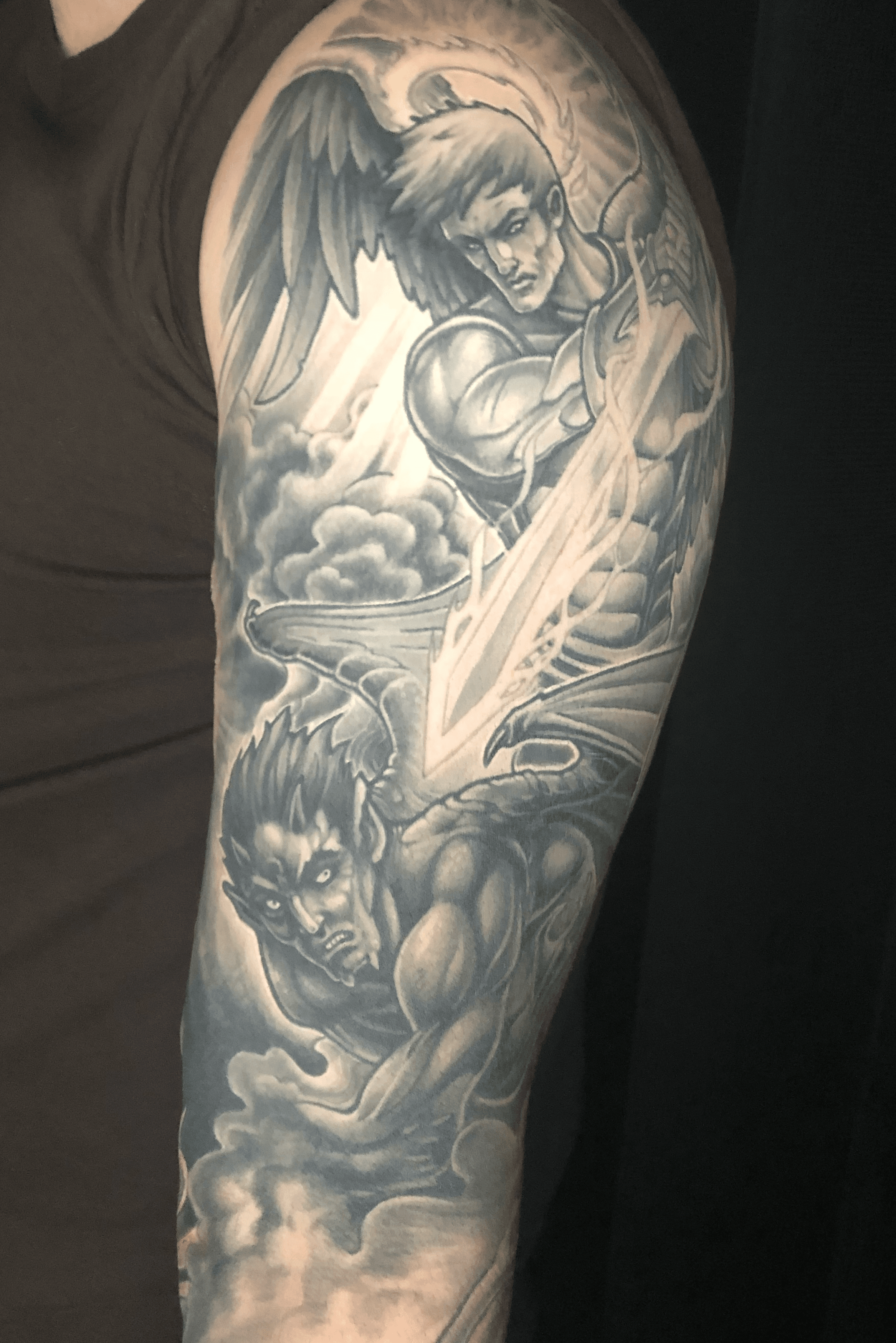 angel vs demon arm tattoo