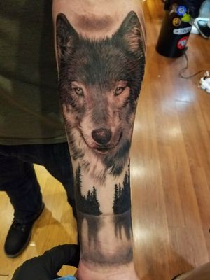 Wolf wilderness tattoo