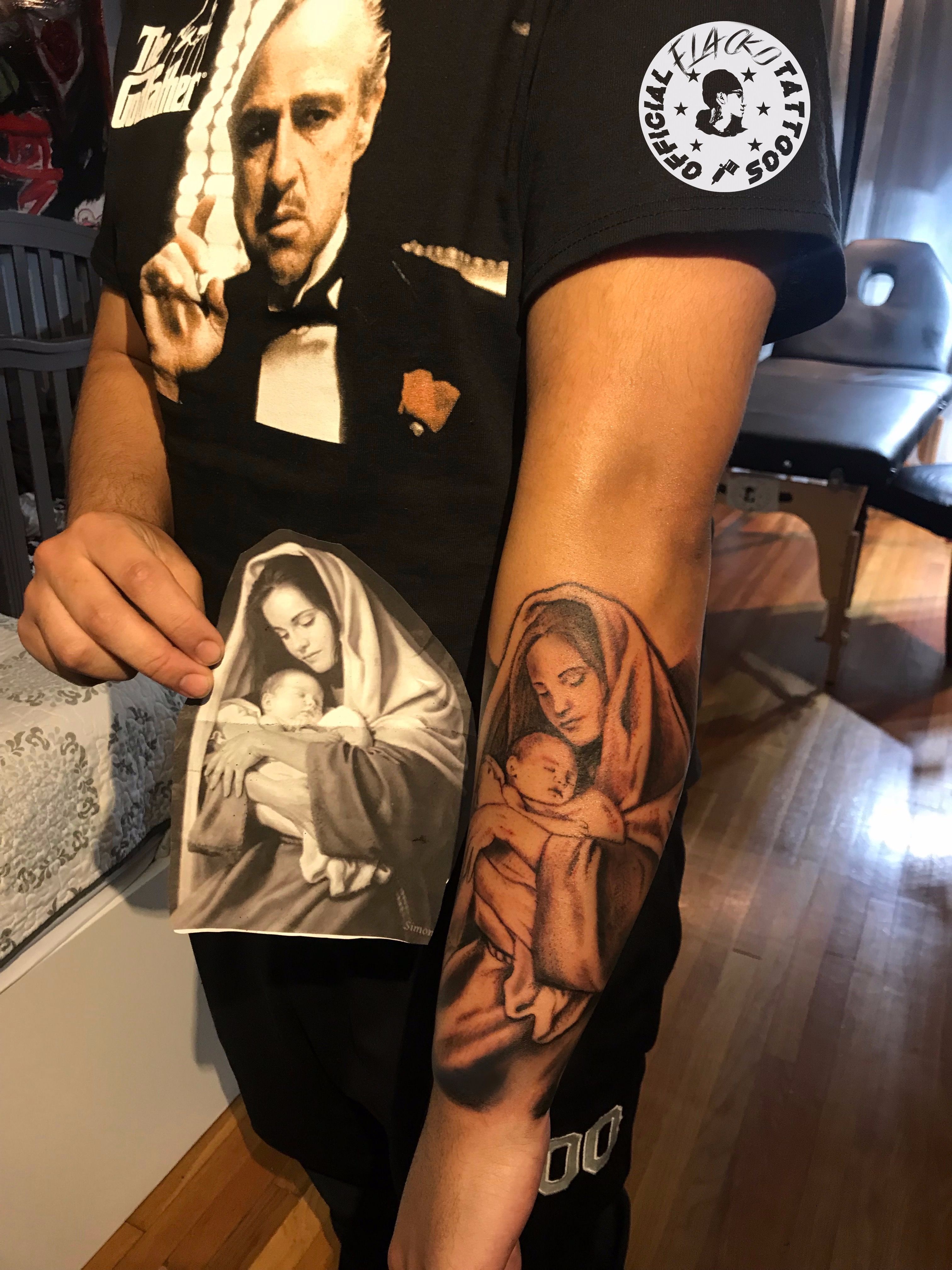 Saint Mary and Jesus Tattoo on arm