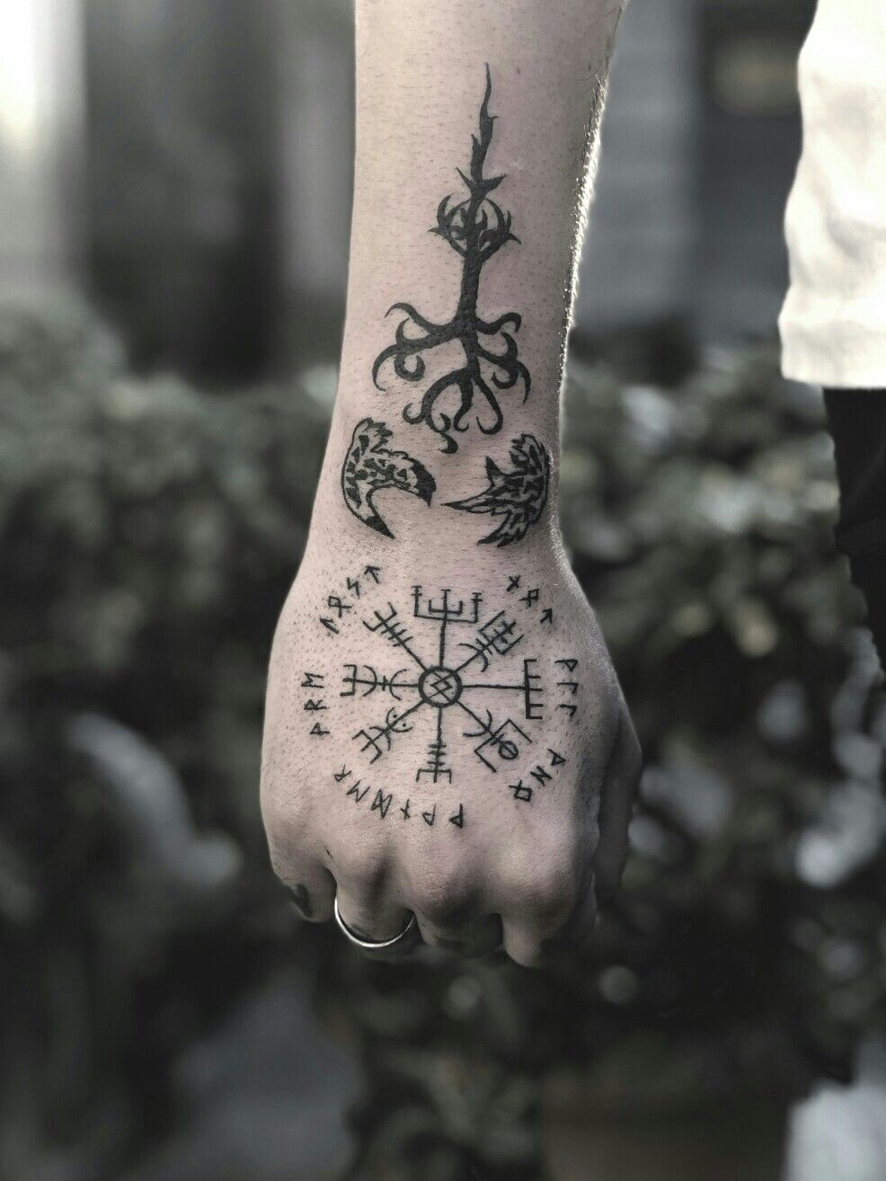 Need help with a tattoo  is there anything Norse about this What did  the runes mean in the circle and under the circle I know the compass  isnt Norse but made