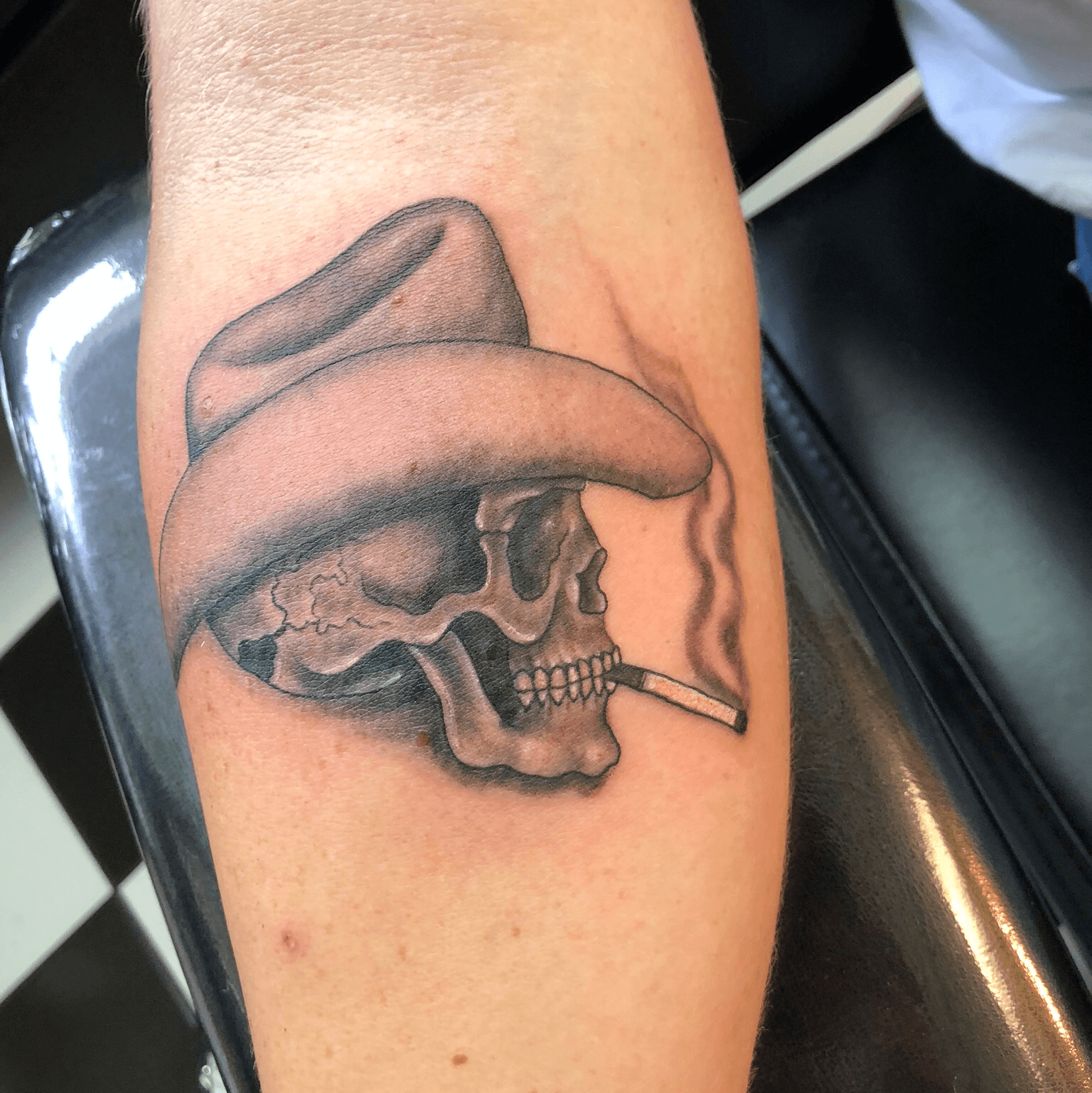 addison The skull of a skeleton wearing a cowboy hat