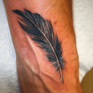 Feather detail on wrist