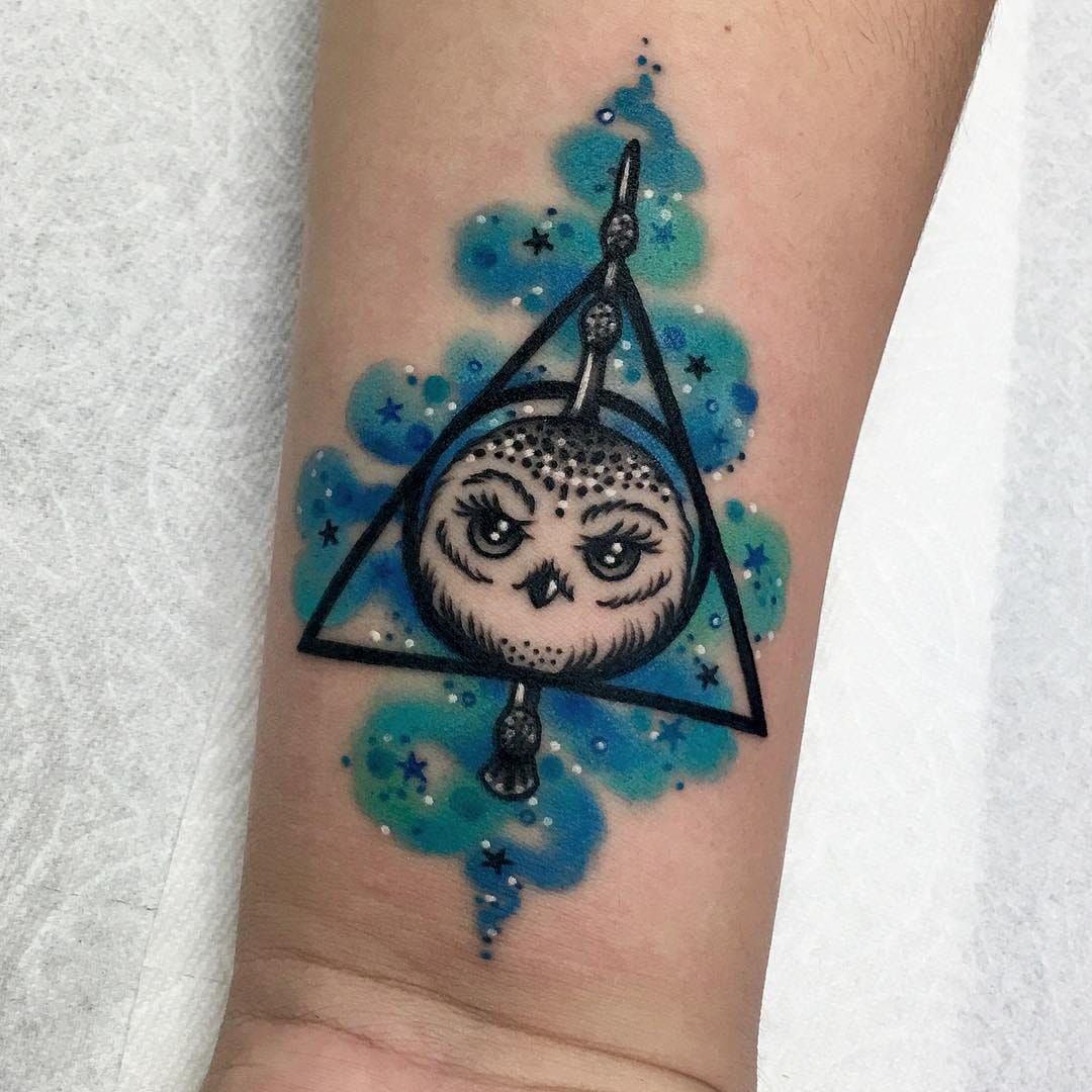 prompthunt deathly hallows symbol  a pokeball hyperealistic tattoo design