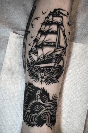 Tattoos by @zimovan #ship #shiptattoo #wolf #wolfhead #wolftattoo #blackandgrey #blackandgreytattoo #blacktattoo #blackwork #blackworktattoo #tattoos #ashevillenc #nctattooers #traditional #traditionaltattoo #AmericanTraditional