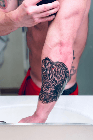 Angry wolf tattoo.