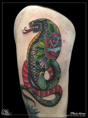 Tattoo by Chad Clark. 
#snaketattoo #rosetattoo #floridatattooartist #capecoral  #tophatclassictattoo #colortattoo  #traditional #traditionalsnaketattoo #traditionaltattoo 