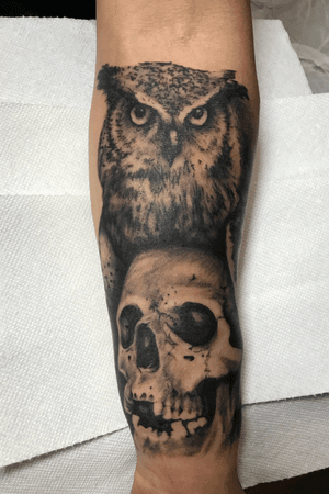 Owl and skull pair on the foream.