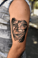 Realistic girl face tattoo.