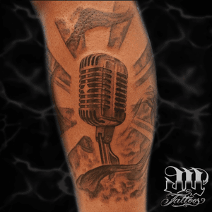 Black and grey Microphone tattoo