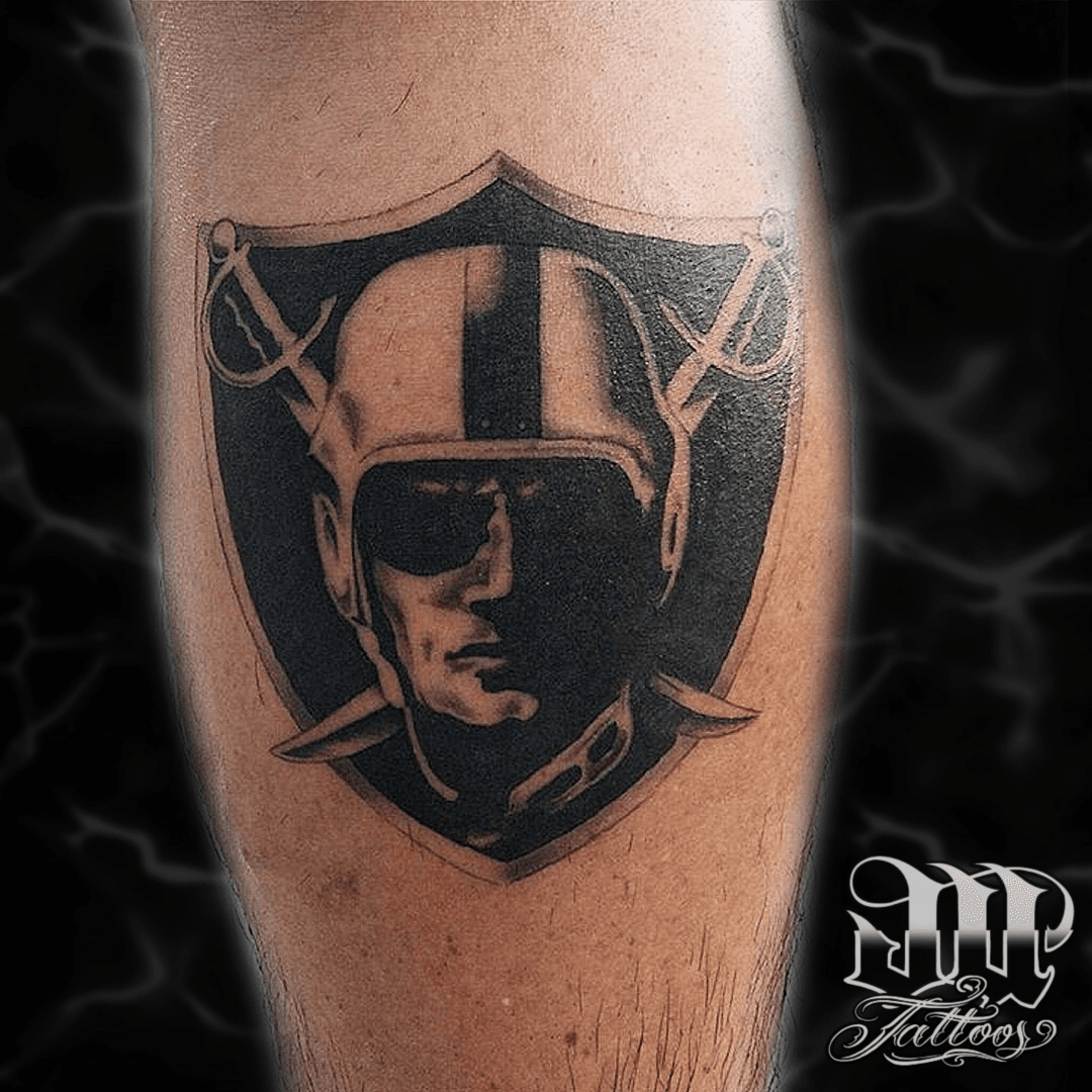 Raiders Inspired Tattoo For Sports Fans On The Arm With Black And Gray   Starry Eyed Tattoos and Body Art Studio