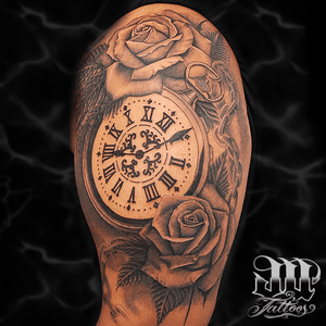 Bog clock and roses tattoo