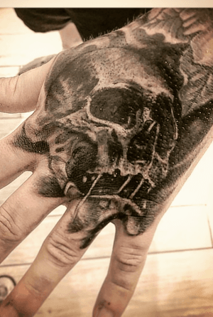 Skull hand tattoo 
