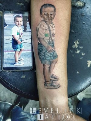 Baby portrait at level ink tattoos