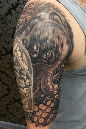 Octopus I tattooed around an old traditional ship in a bottle! 