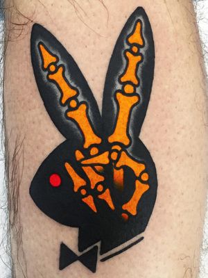 Tattoo by Javier Rodriguez #JavierRodriguez #coolesttattoos #cooltattoo #favoritetattoo #besttattoo #color #traditional #playboybunny #skeleton #peace #bunny #funny