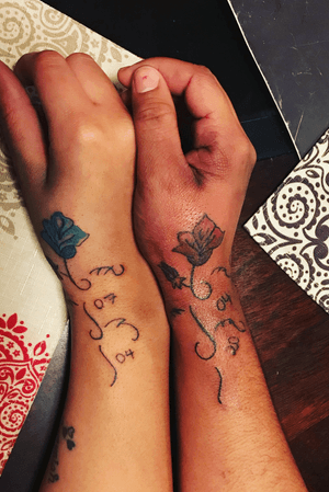 Matching flower tattoo on wrist 