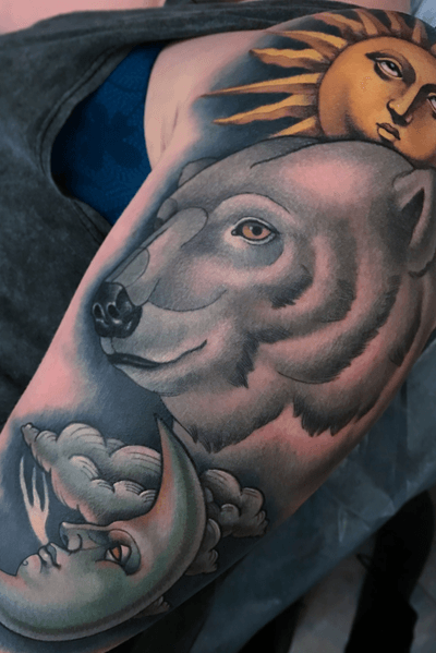 Polar bear with sun and moon tattoo