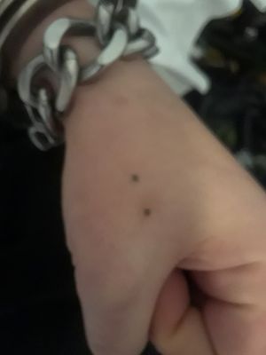 My mom had on her right hand same tattoo but it was 3 dots so I did the left only 2 dots....