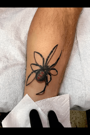 Reasonably realishtic looking spider tattoo on a ankle 