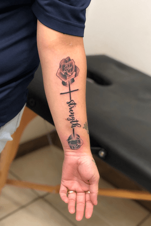 Not an original idea but my client let me have a little freedom with it to make it “my own” #blackandgrey #rose #roses #blackandgreyrose #cross #crosstattoo #strength 