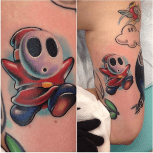 Shy Guy tattoo done on the back of an arm. 