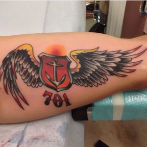 Winged shield on an inner arm fir a firefighter. 