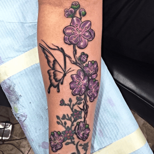 Some purple cherry blossoms done on an inner arm. 