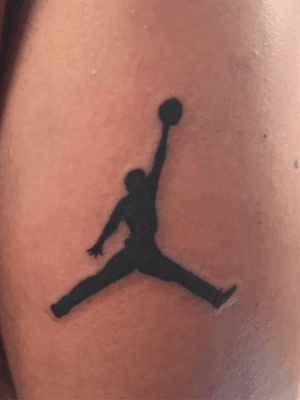 This tattoo is about the size of a qaurter! Fun lil air jordan jump man! 