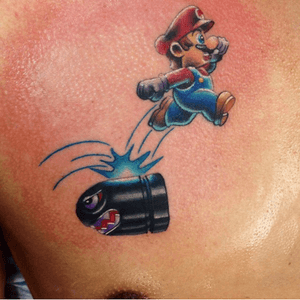 Mario jumping on a bullet done on a chest. 