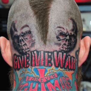 A couple if skulls and “Give me War” tattoo done on the back of Chris “Birdman” Andersens head while he was playung for the Miami Heat. 