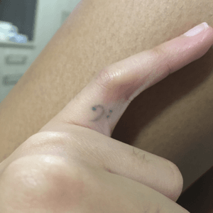 No it is not faded (example of what happens when you go for price rather than quality or reputation), no it is not a frowny face. This was my first tattoo at 17 and is a bassclef (music signature) #bassclef#finger#hand#pinky#music#small