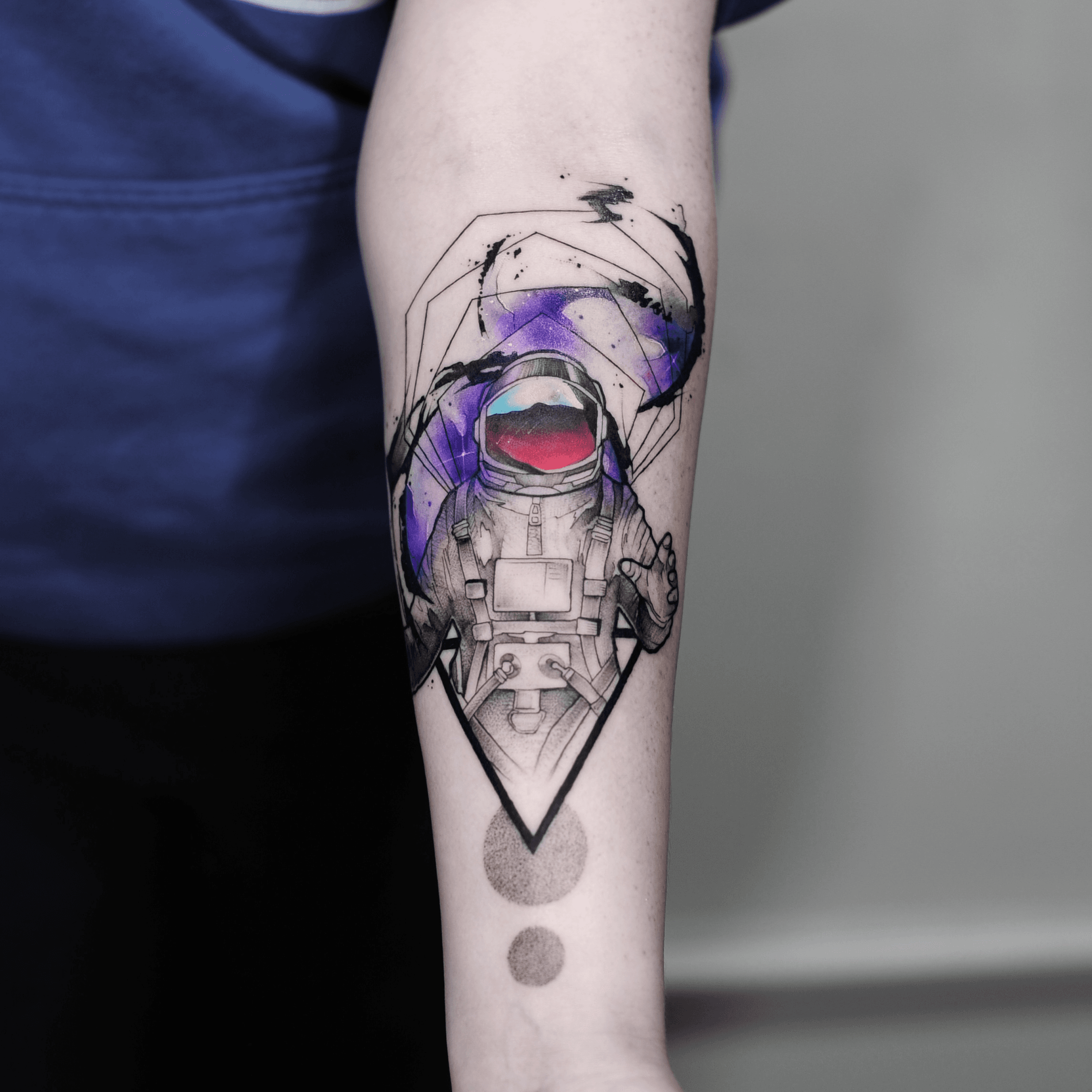 Surrealistpsychedelic astronaut tattoo on the right
