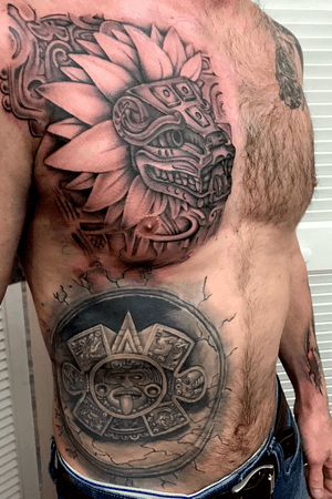 Aztec inspired chest piece by Joshua Nordstrom done at Deft Tattoo Studio in Kingsford Michigan #latinoart #blackandgrey #aztectattoos #mesoamerica #mayan #chesttattoo #tattoosformen 
