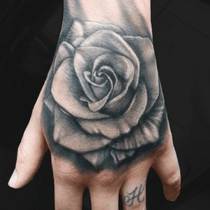 Hand Rose tattoo by Jesse Vardaro