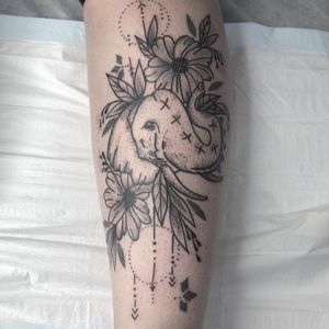 Custom dotwork and linework elephant tattoo with floral designs 